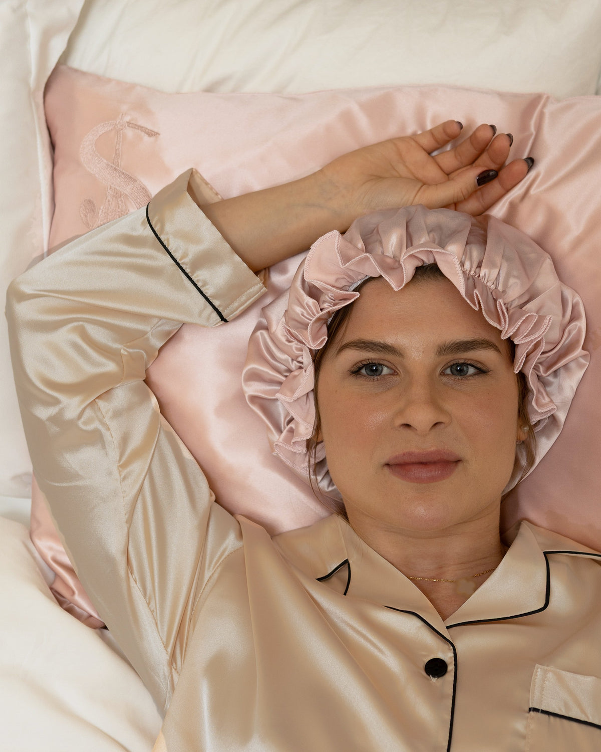 Siluxe silk pillowcase in Rose gold, with the Comfort silk bonnet in Rose gold