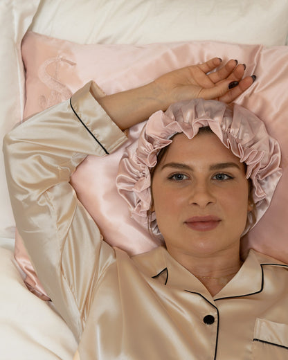 Siluxe silk pillowcase in Rose gold, with the Comfort silk bonnet in Rose gold