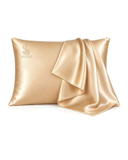 Siluxe silk pillowcase in Gold, Standard 50 × 70 cm, a second case draped over it, product view on white